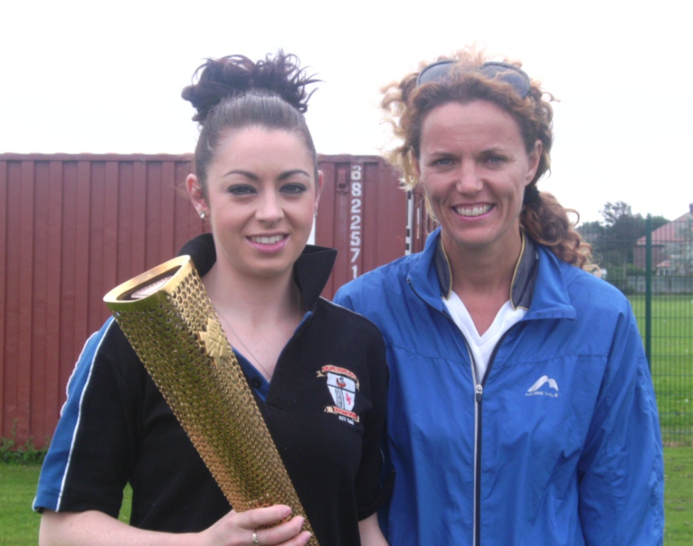 Olivia McDonald with Olympic Torch at Southport Waterloo AC Open Meet (Liverpool, September 2012)